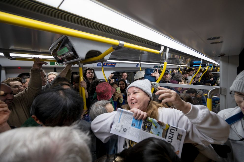 Passengers aboard one of the first Metro Tunnel trains. 