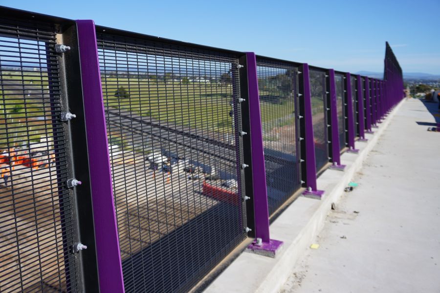 Railings on the new Hopkins Road bridge have been painted purple