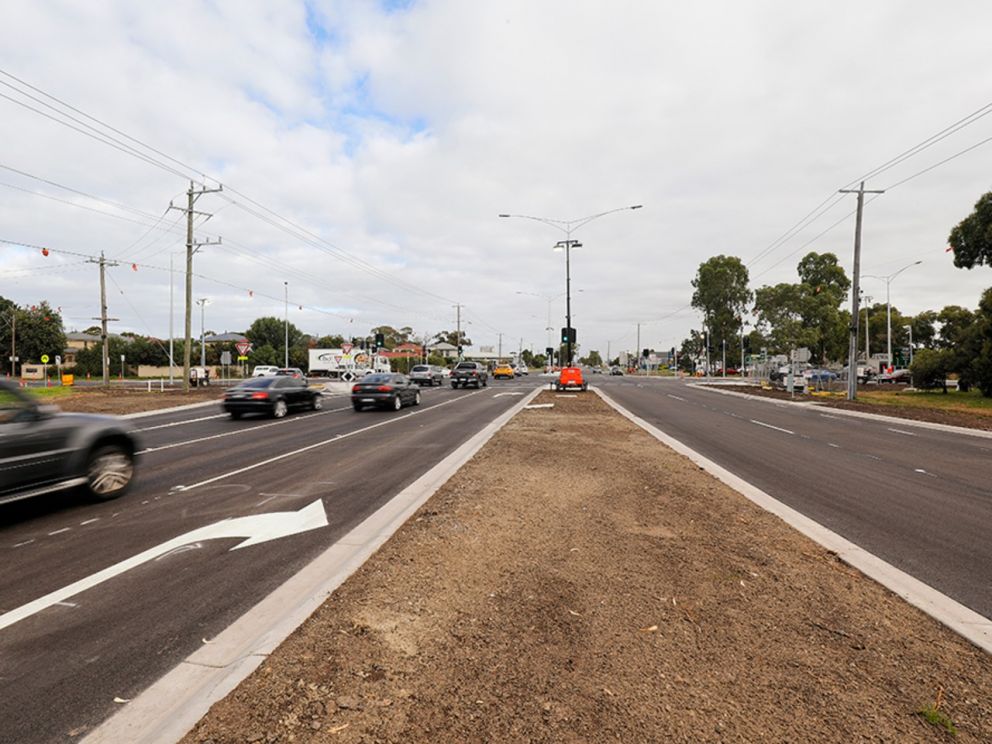 Traffic using the new lanes on Wells Road with cars driving on the traffic