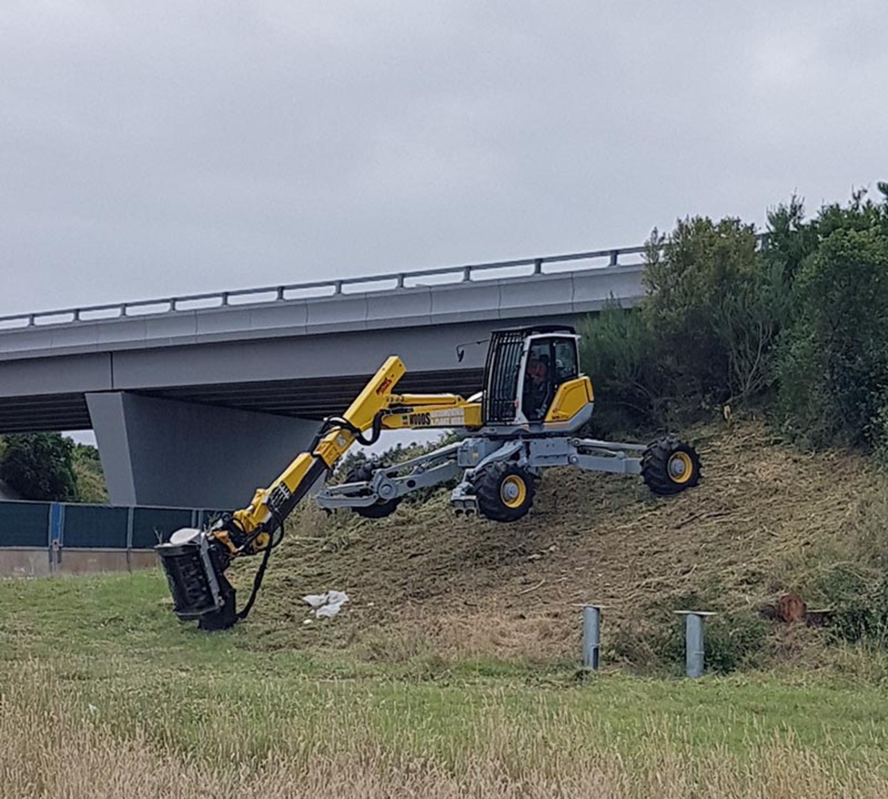 Monash Freeway spider excavator on a hill