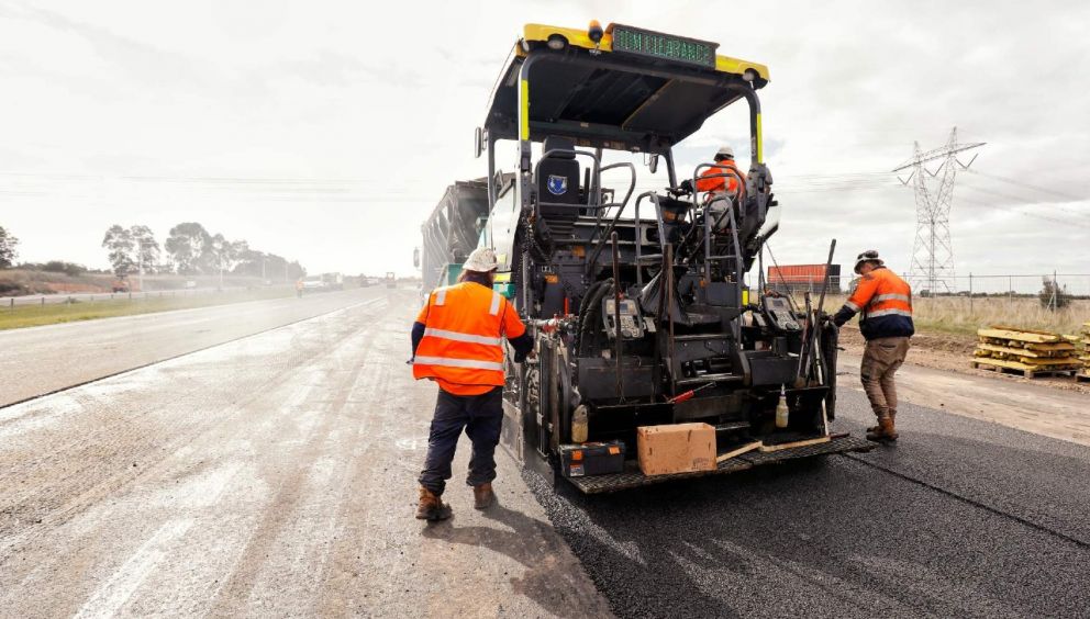 Laying the final coat of asphalt to build the new entry and exit ramps from O’Herns Road