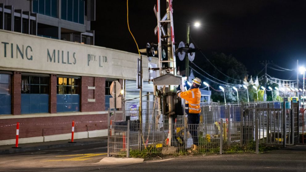 Workers remove the Munro Street boom gates
