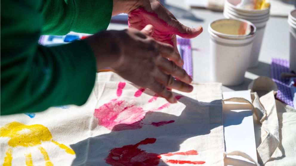 Shepparton community event hand print being made with paint during creative activity