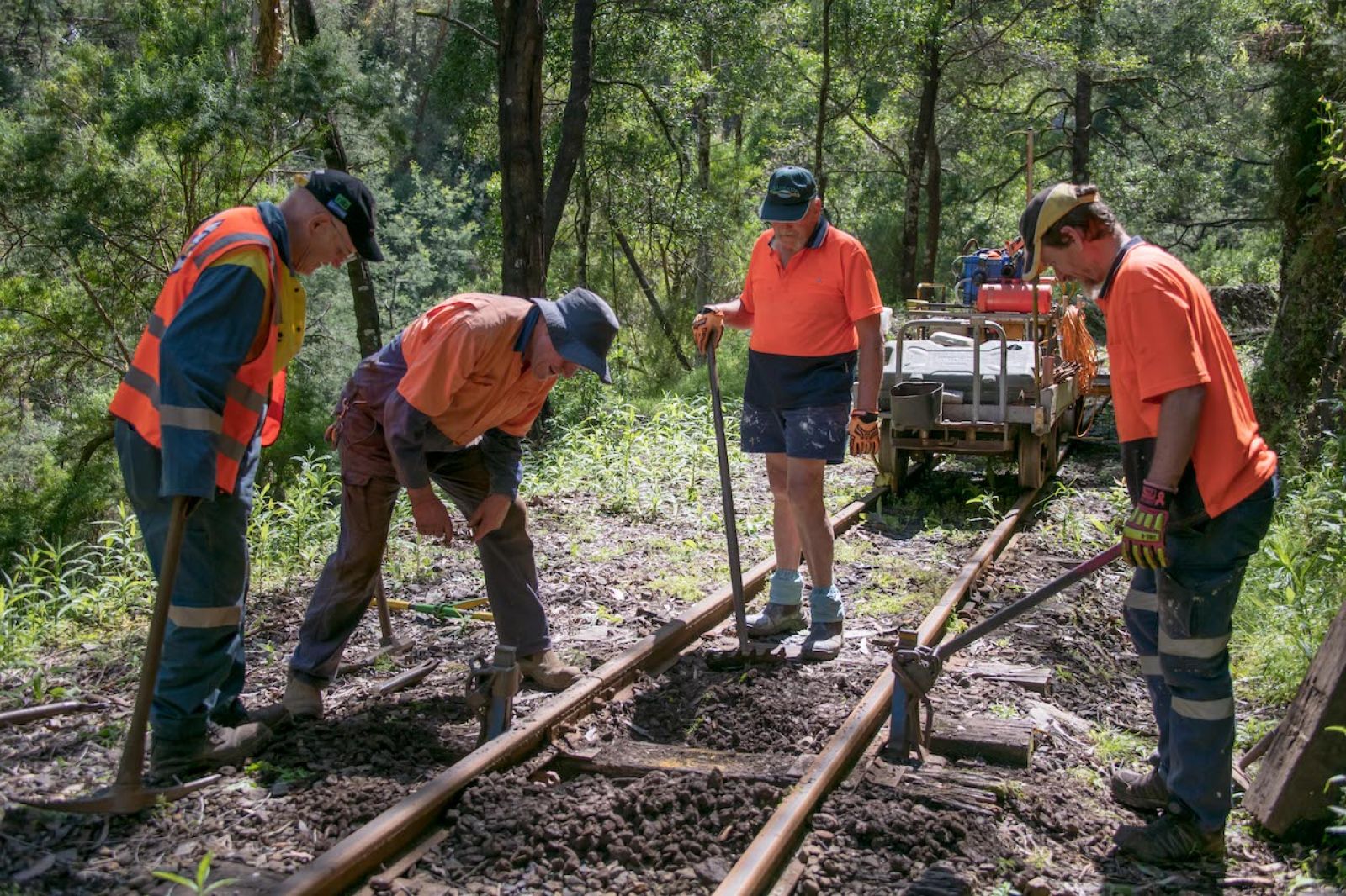 Volunteers replace sleepers on the track