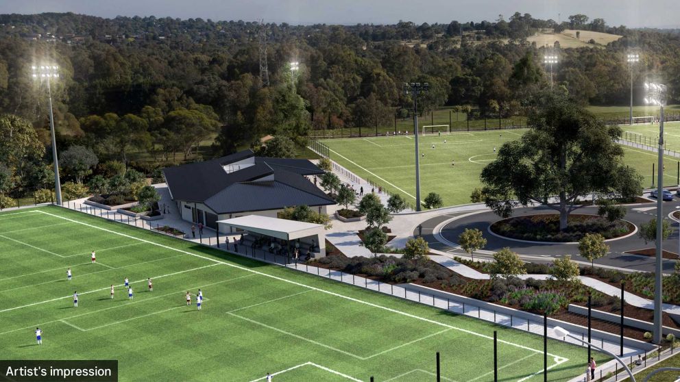 Aerial artist impression of new soccer facilities including 3 soccer fields, sports pavilion and car park.