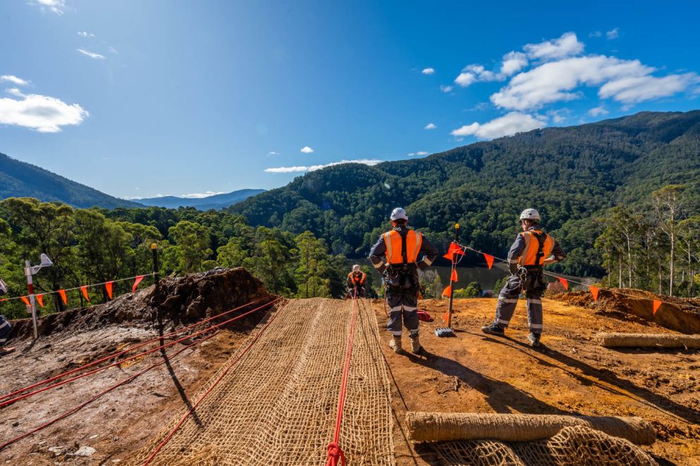 Anti-erosion mesh being installed at the top of the Bogong High Plains Rd landslip