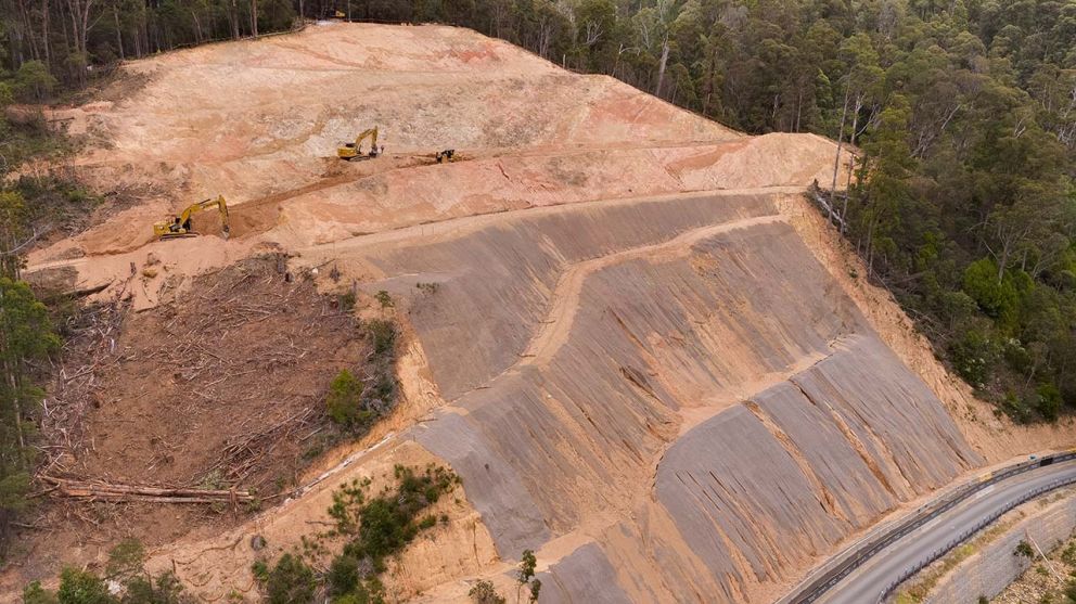 Excavators continue clearing works at the top of the landslip