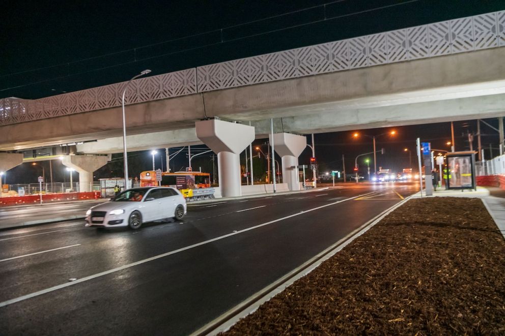 Cars drive through Keon Parade