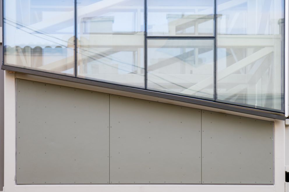 Close up on the lift shaft’s glass paneling