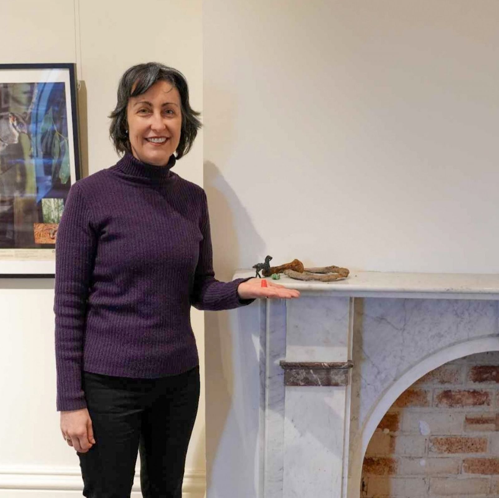 Curator Ruth McLean with the donated items