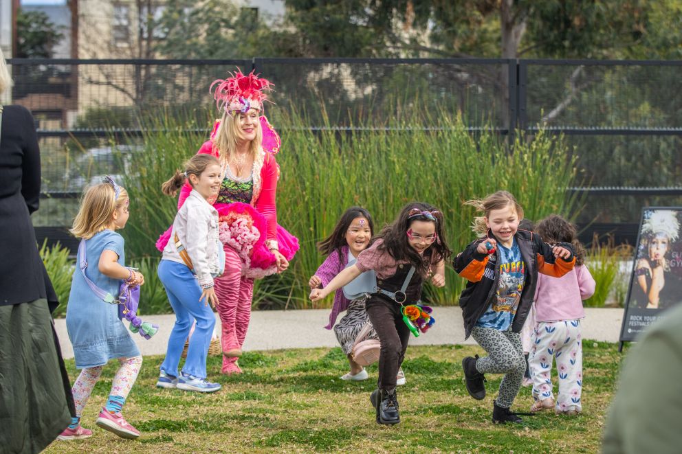 A performer dressed as a fairy entertaining children