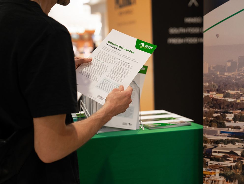 Man holding fact sheet at event