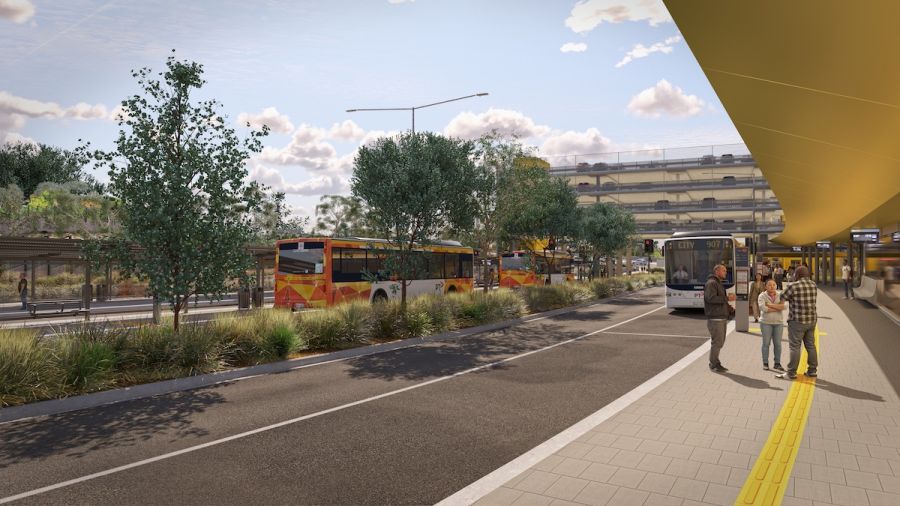 A bus station featuring multiple buses parked at designated lanes, with 