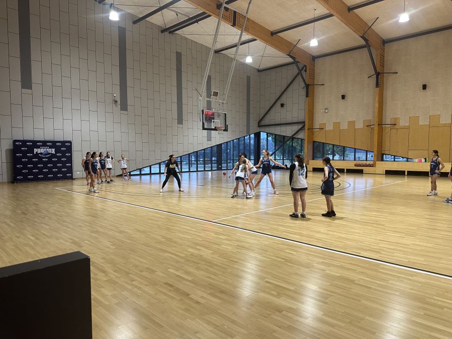 teams playing indoor basketball