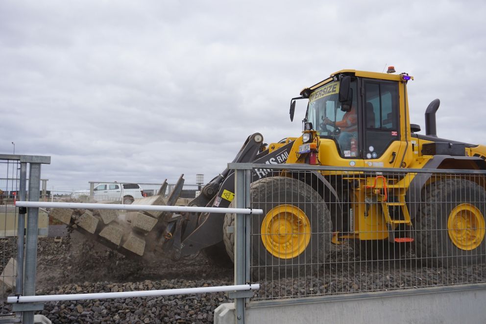 A wheeled loader removes old rail sleepers during a recent construction blitz at Hopkins Road