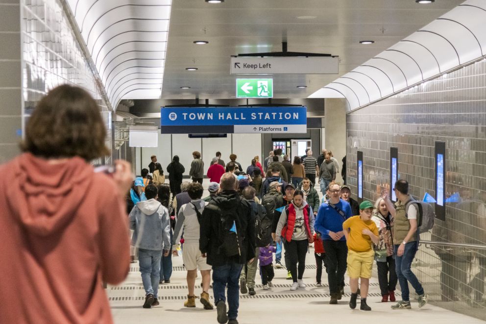 Passengers walking along the interchange between Town Hall and Flinders Street stations. 