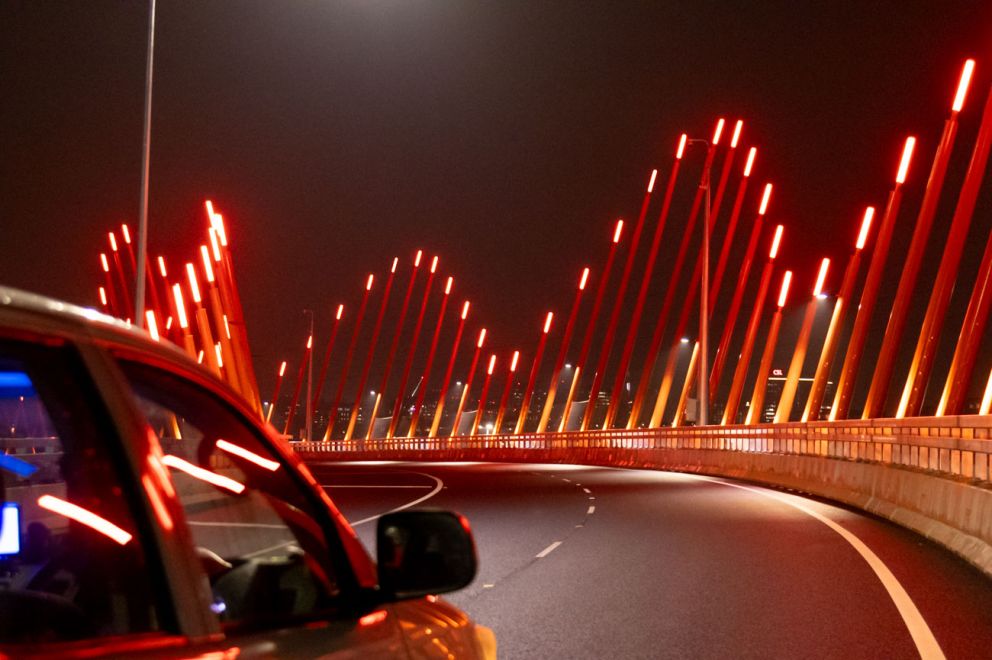The distinctive orange lighting poles on the Citylink ramp.