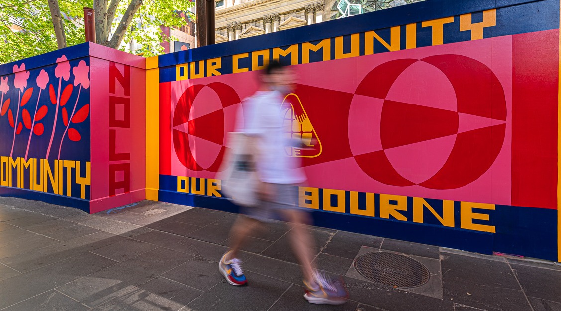 Artwork of walls painted in bold colours with words 'NOLA' and 'Our Community, ‘Our Melbourne’.