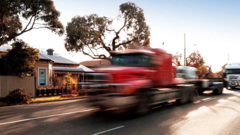 A truck travelling on a local street.