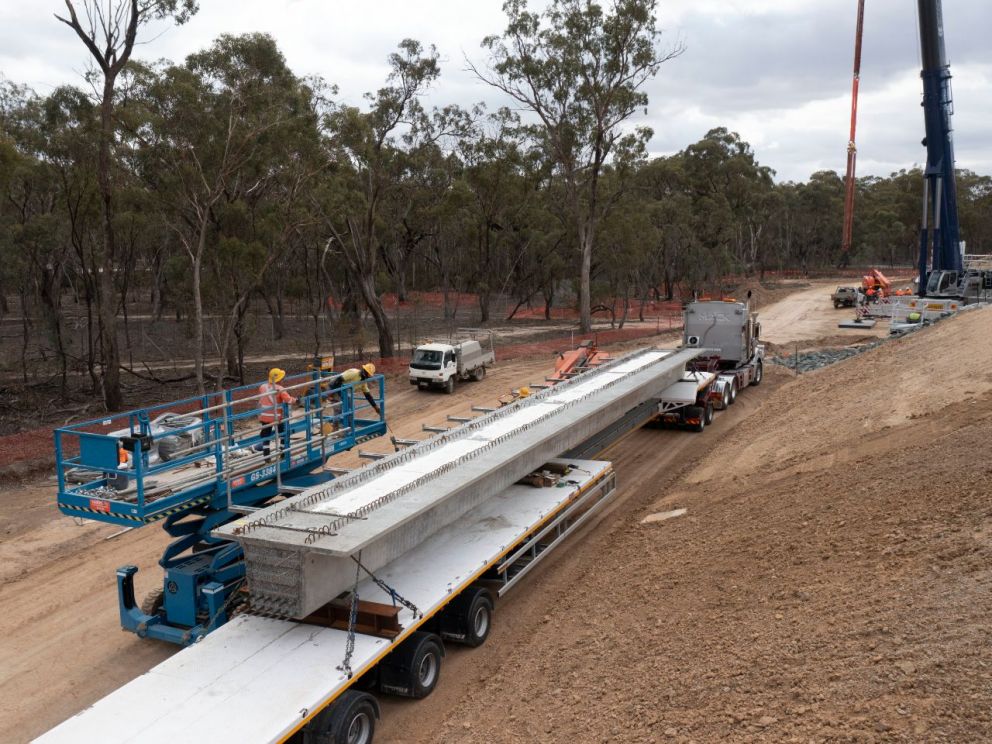 The last of the 125 super-tee beams being transported to site