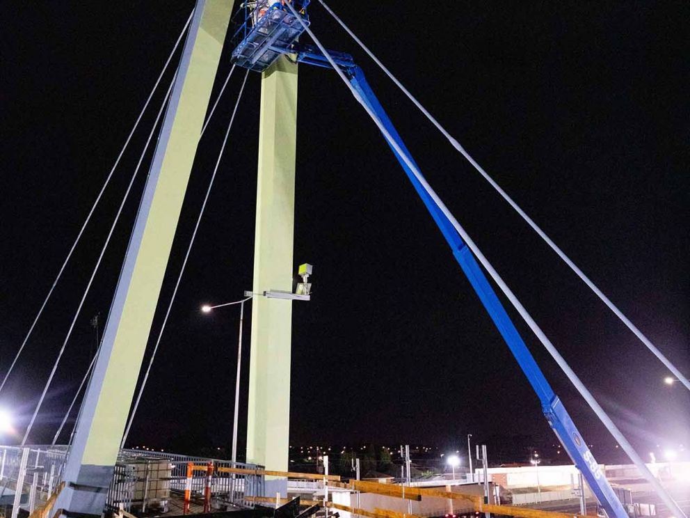 The Blaxland Avenue overpass being painted in the colour 'Kikuyu' which was chosen by the local community.