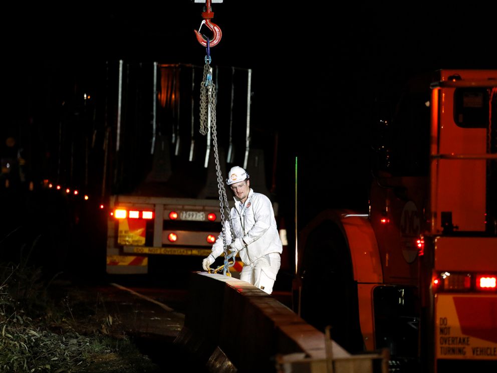 Safety barriers being lifted into place