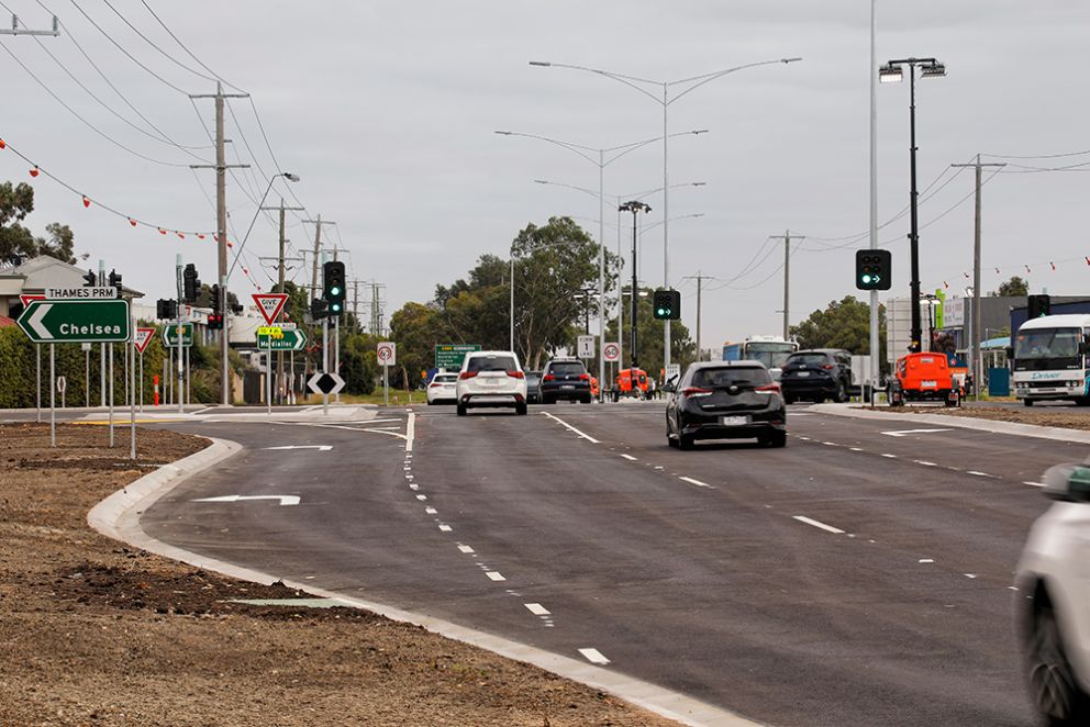 Mordialloc Freeway project - Traffic using the new lanes on Wells Road where it intersects with Thames Promenade. There are cars travelling along Wells Road