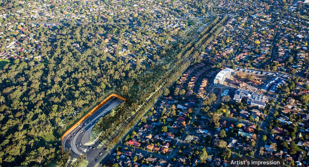 Artist’s impression aerial view looking south along the new Greensborough Road boulevard, Borlase Reserve parklands and Lower Plenty Road interchange, Yallambie. The ramps in and out of the tunnel are for trips to and from the Eastern Freeway on North East Link.
