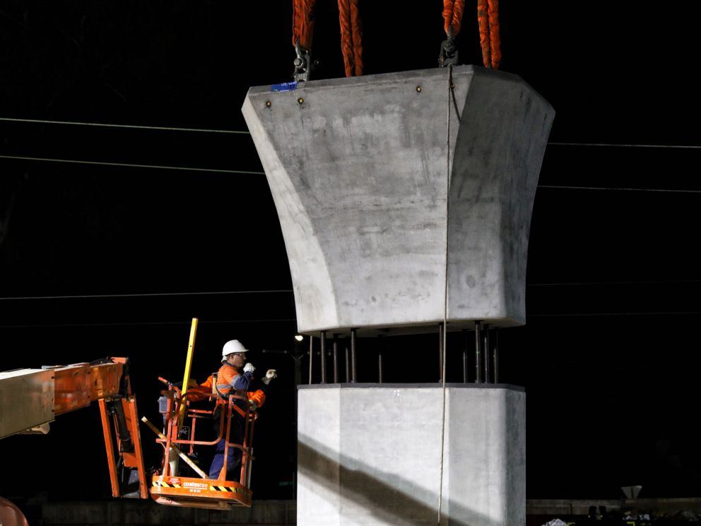 Large concrete beam going into place