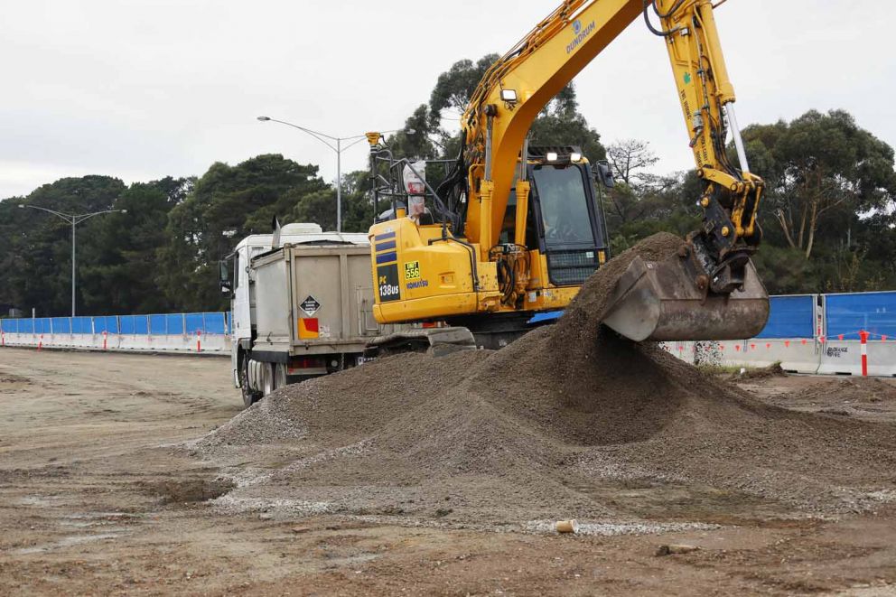 Earthworks behind the barriers at the Cranbourne-Frankston Road intersection