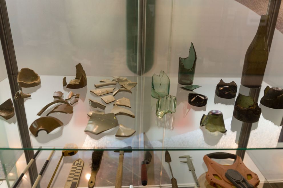 Artefacts in glass cabinet