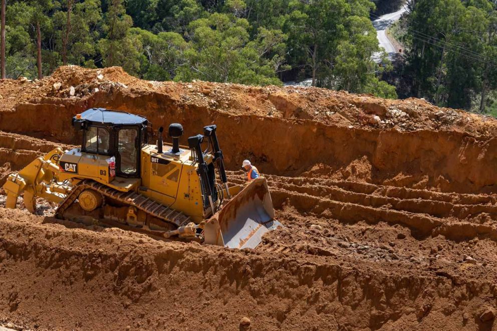 Crew inspects D8 bulldozer 24 March