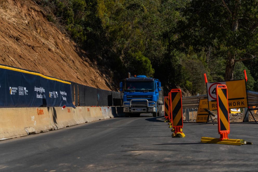 A construction truck makes its way through the work zone 21 April