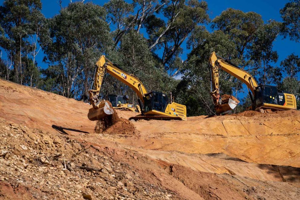 Excavators work on trimming back the landslip 14 April