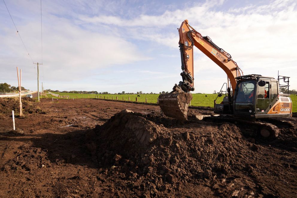 One scoop at a time - An excavator stockpiling material from all over the Hall Rd Upgrade project