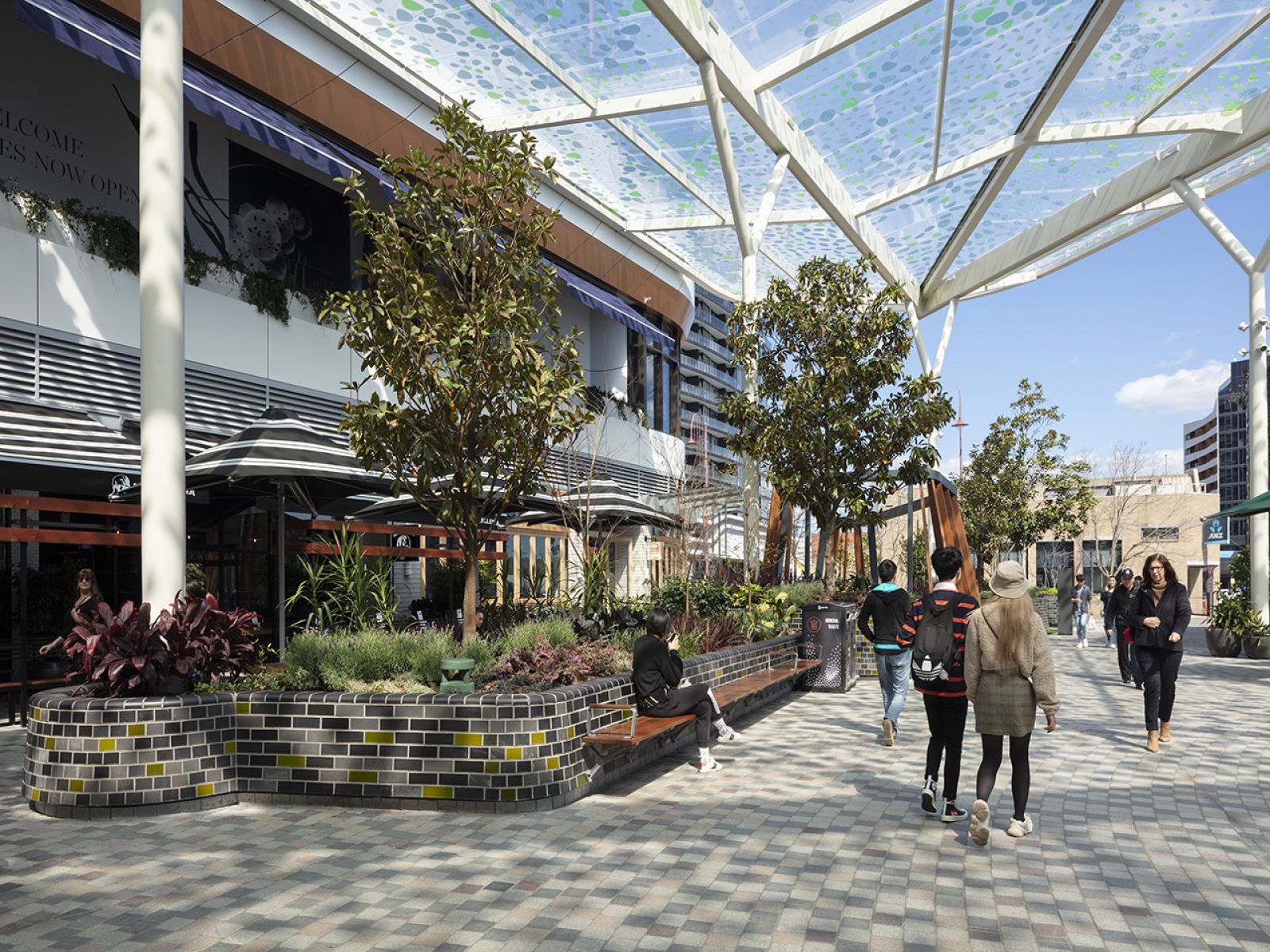 image shows community members walking around The Glen shopping centre