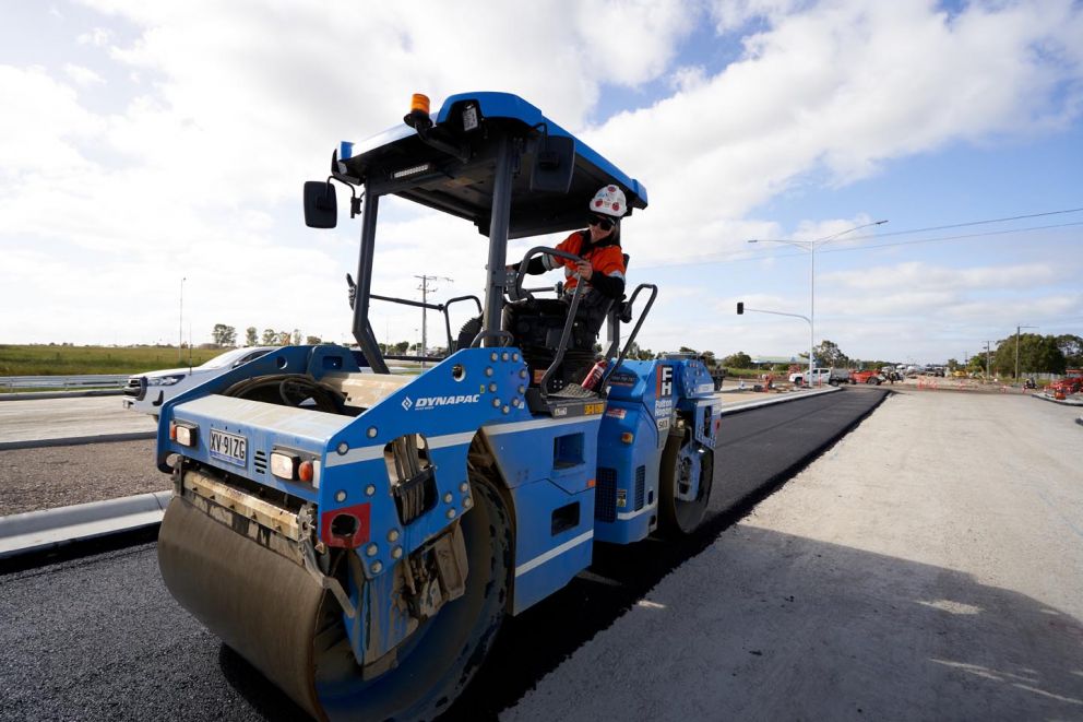 Crews laying asphalt on the new Western Port Highway intersection