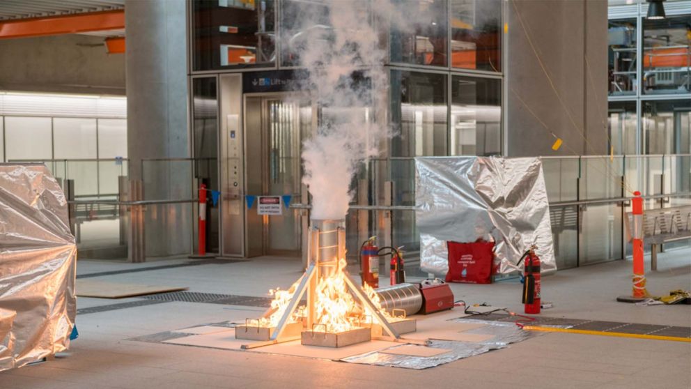 Fire extinguishers next to smoke testing system 