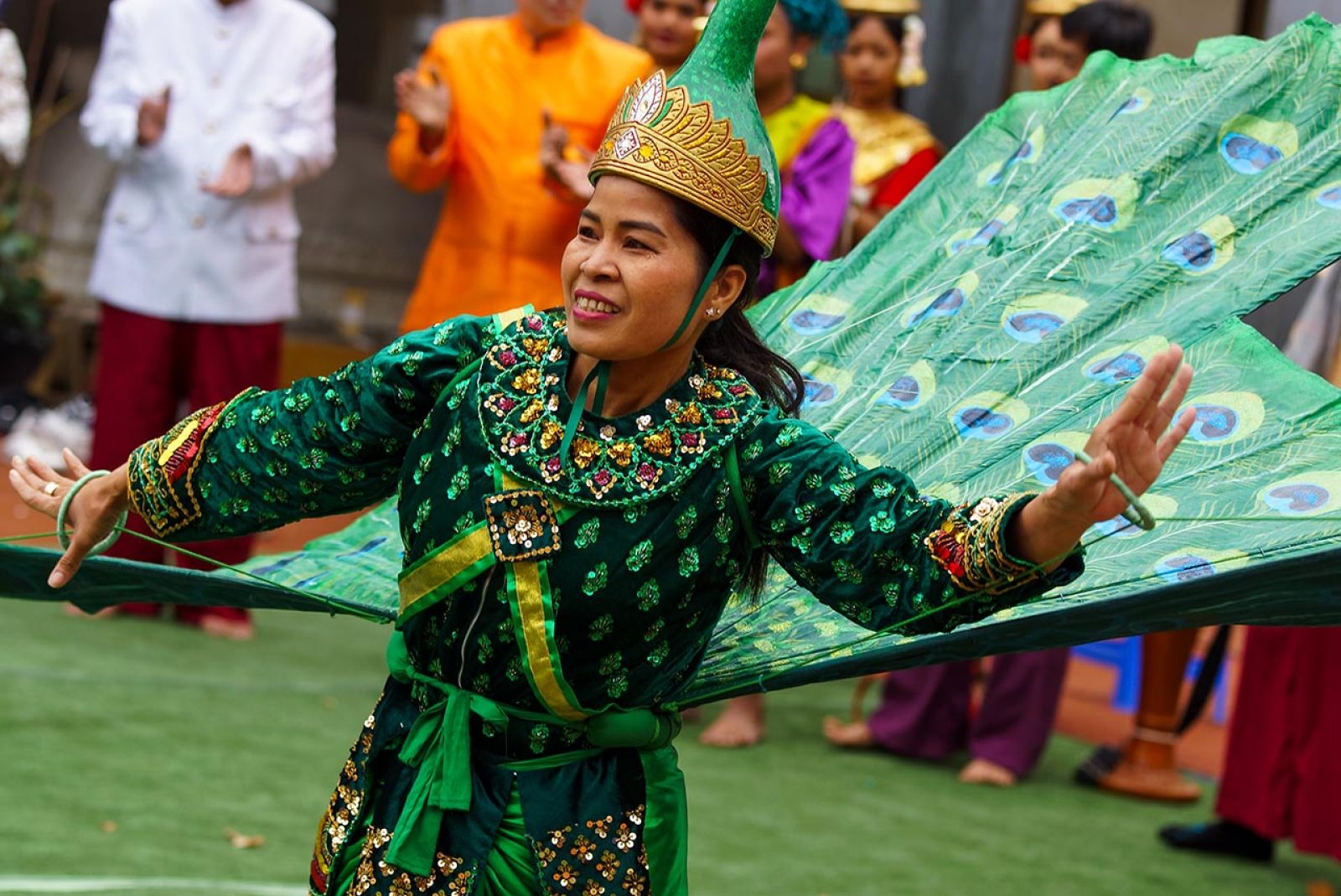 A woman dancing in her cultural costume