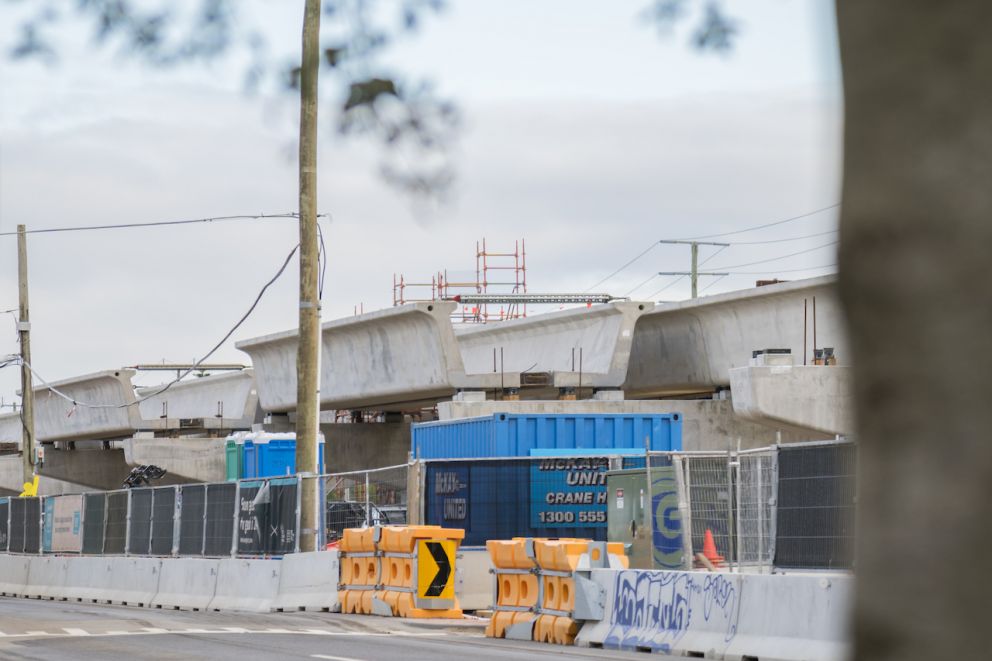 Concrete u-troughs installed on top of piers for the rail bridge structure