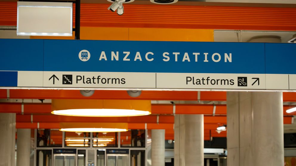 Signage on the platforms at Anzac Station