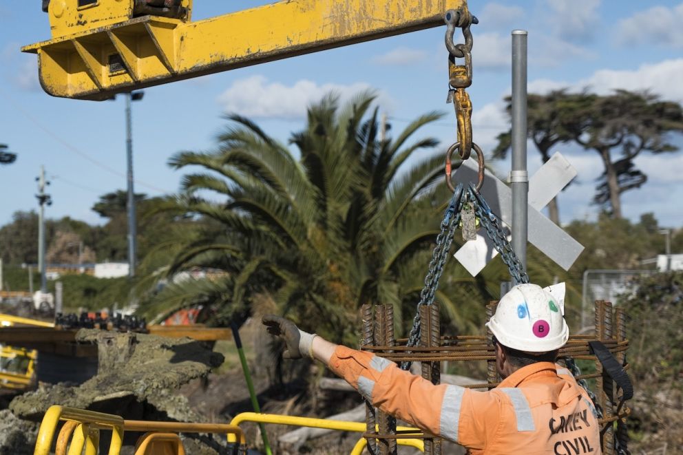 Piling for rail overhead power line structure is happening along the Frankston Line in Mordialloc with a  reinforced cage about to be dropped into place
