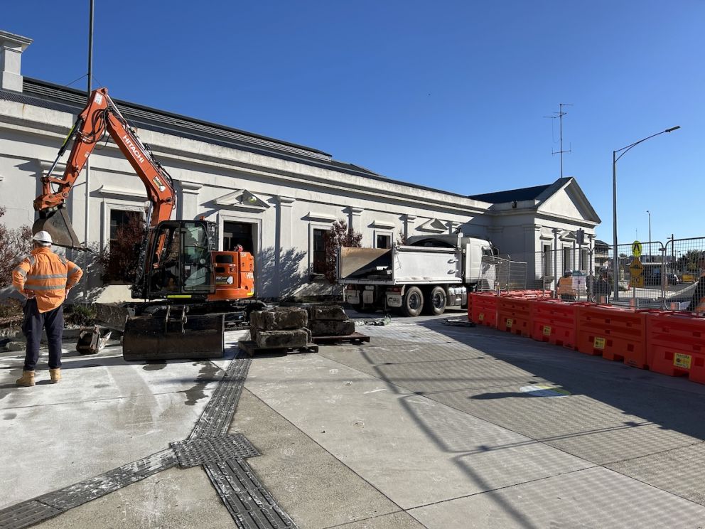 Crew members working on the main northern entrance