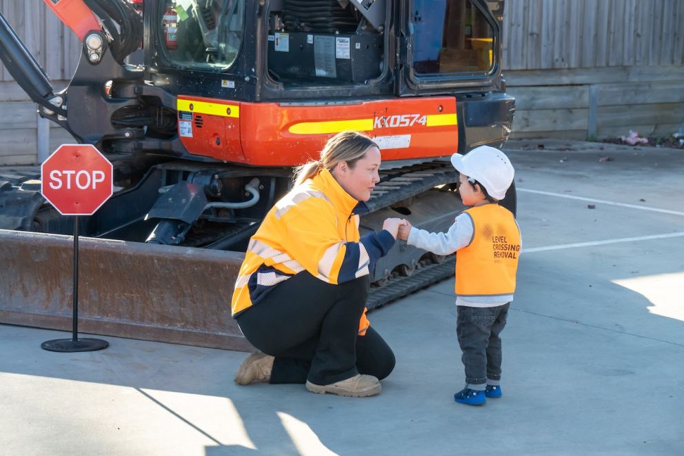 One of our team gives a child a safety briefing before they hop in the digger