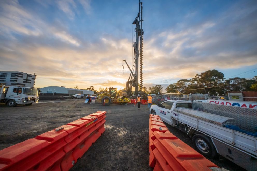 A pilling rig excavates a piles for overhead wiring posts where the rail line will be once level crossing removal works are completed
