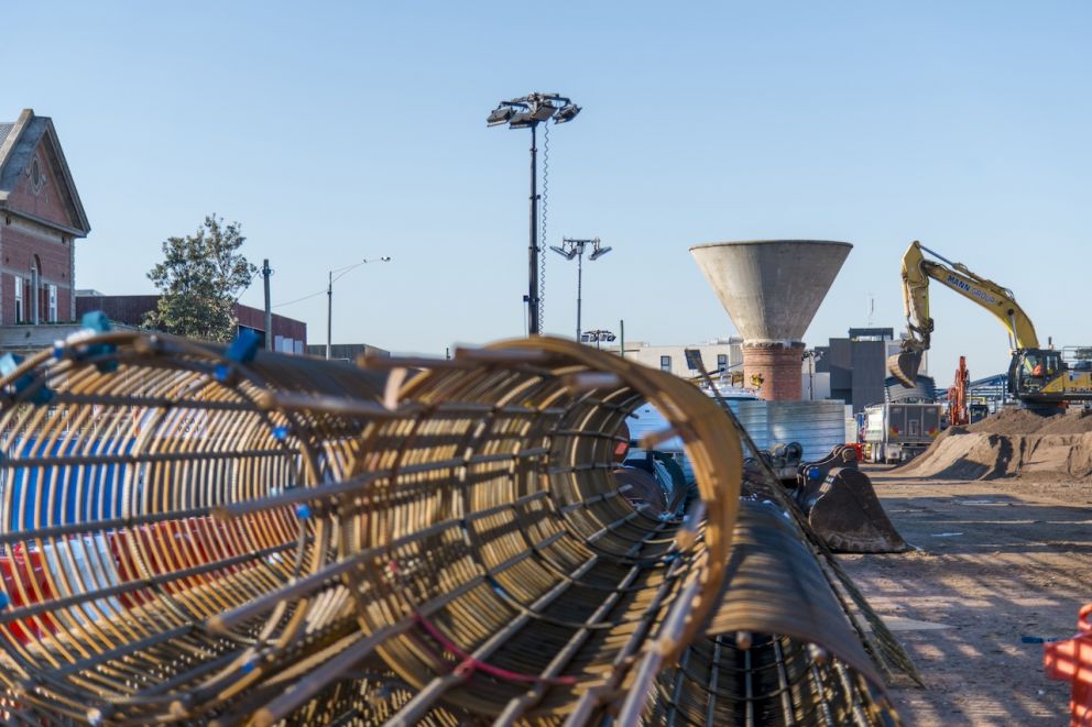 The heritage water tower overlooks steel reinforcement cages on site