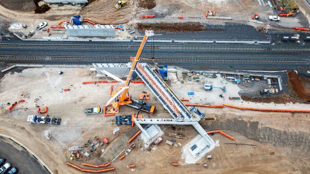 The new Hopkins Road bridge is taking shape next to to the rail line in Truganina