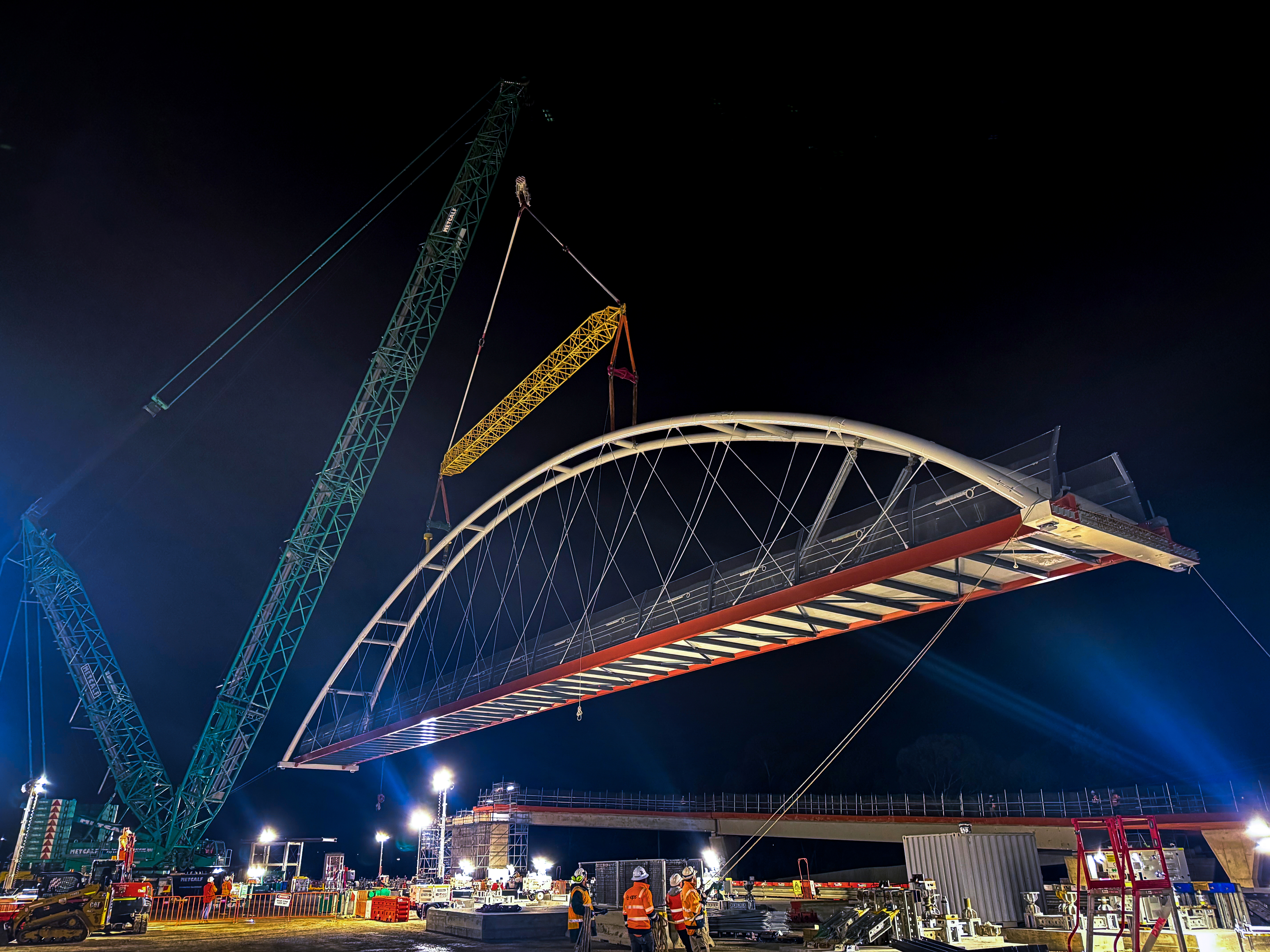 A crane lifts the new Heyington bridge into place