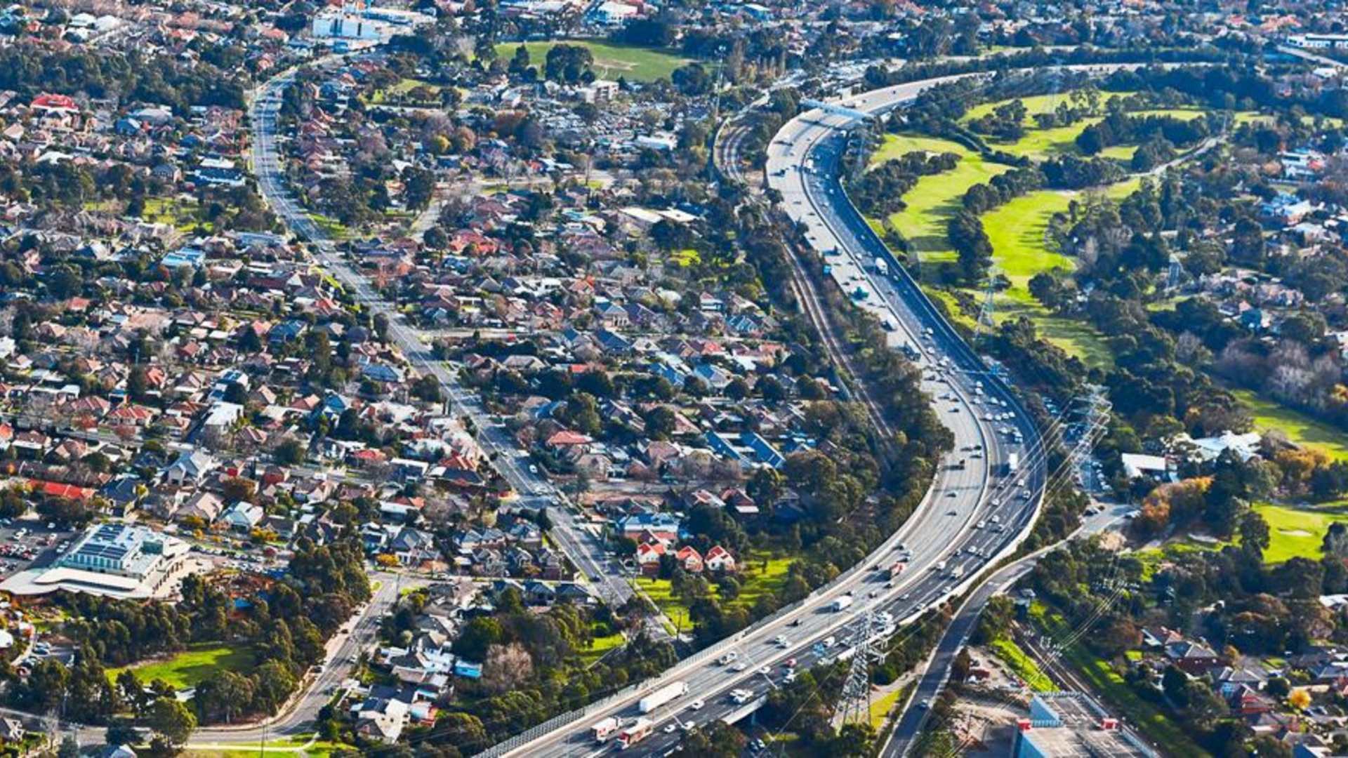 Aerial view of the Monash Freeway displaying the abundance in housing surrounding the freeway.