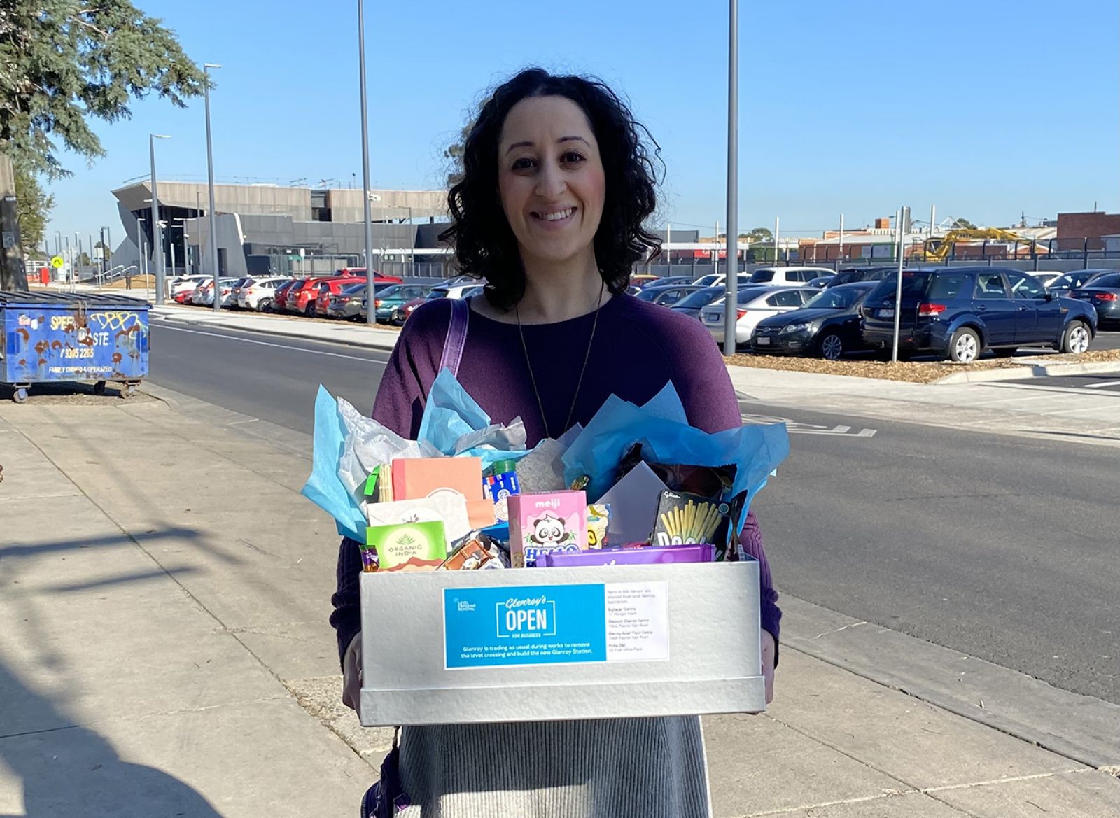 Glenroy Spend and Win winner Kathleen holding the hamper she won